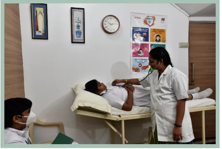 Healthcare professionals attending to students