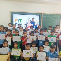 Classroom of students displaying their Fit India fitness posters